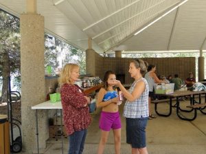 Two women and a child in a building